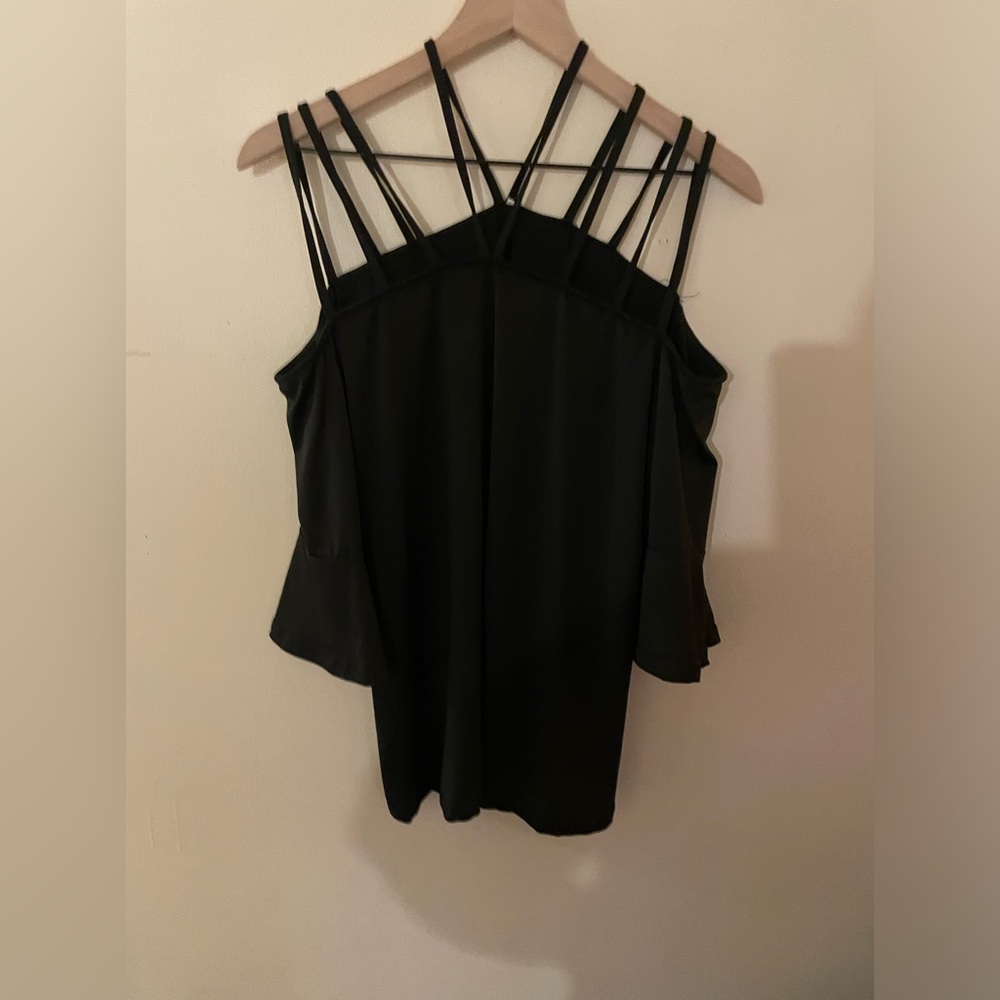 Black knit top and size large with three shoulder straps on each side